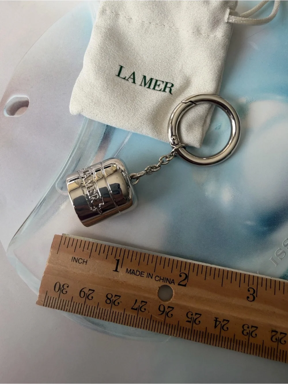 La Mer Silver Tone bag charm / Keychain with Drawstring Pouch